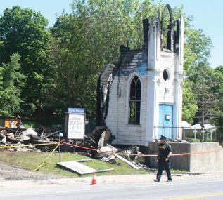 St. James Church after the fire, one year ago; file photo
